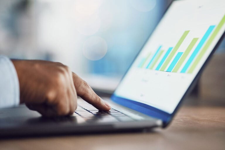 hand on laptop analyzing chart data for business 2026 01 09 10 14 34 utc scaled
